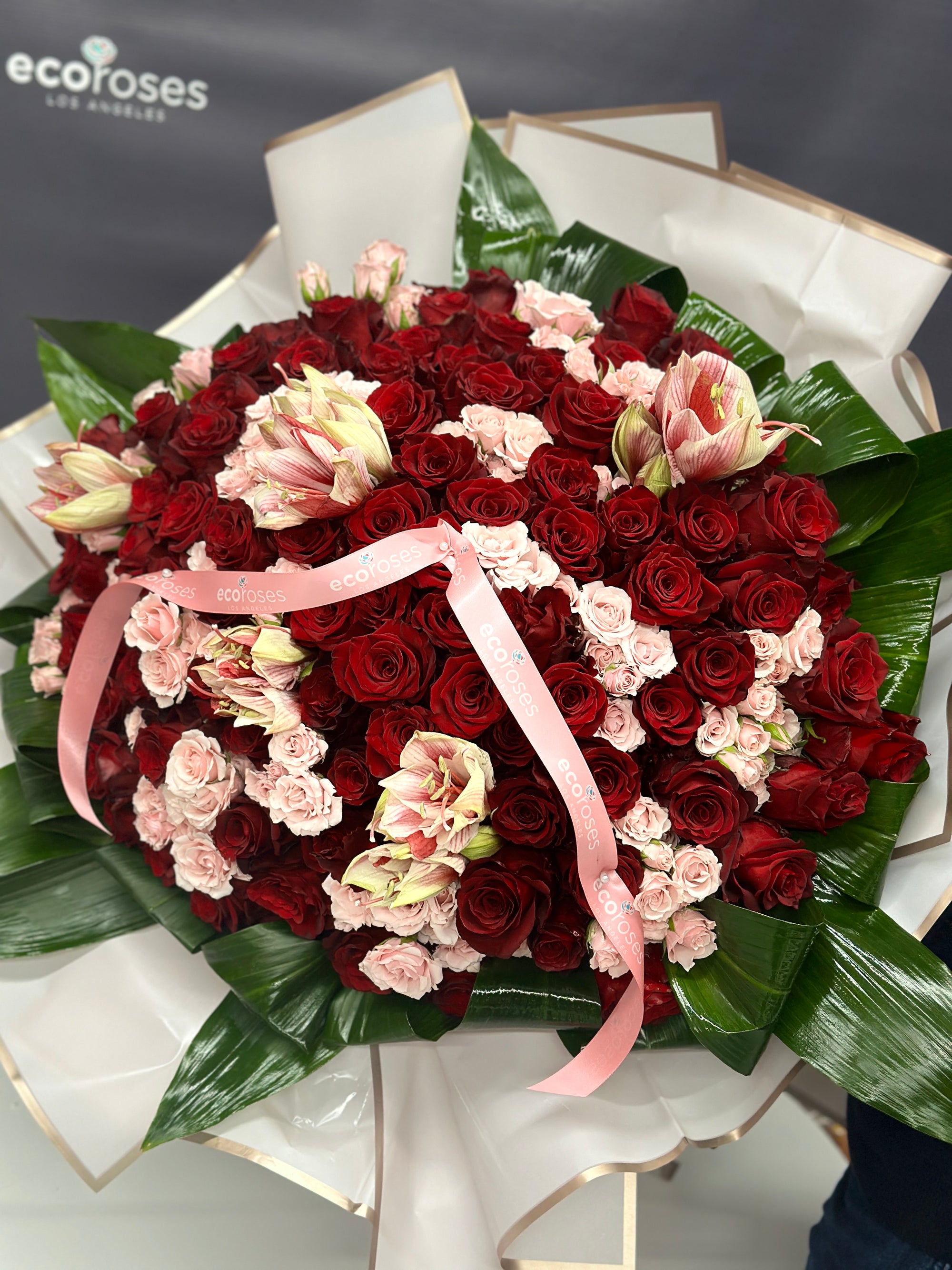 Red Roses LA Crimson Charm bouquet arrangement features beautiful red and pink roses