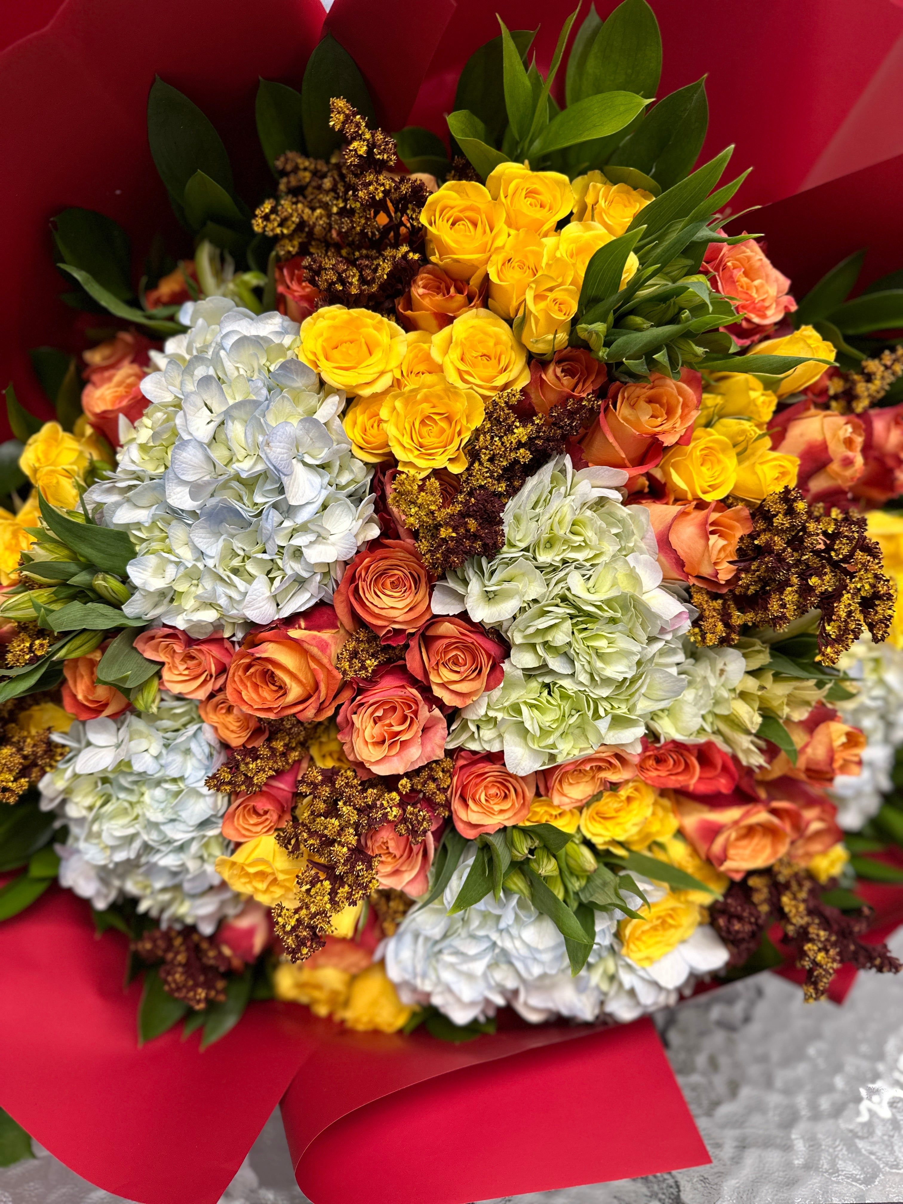 Glendale Florist Ca-With 75 vibrant yellow and orange roses, this deluxe bouquet