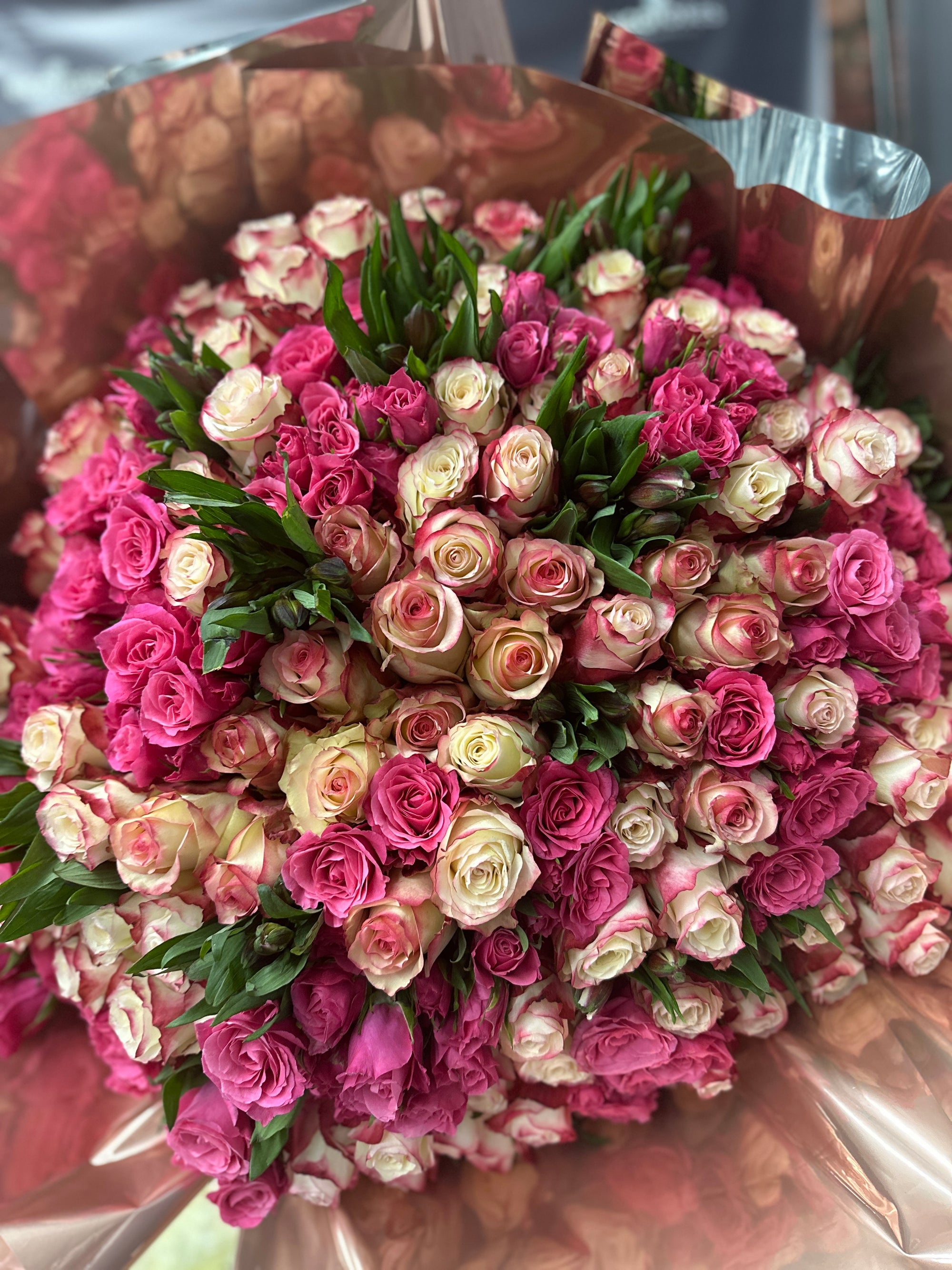 Luxury Roses Love's Embrace, a deluxe bouquet overflowing with vibrant flowers