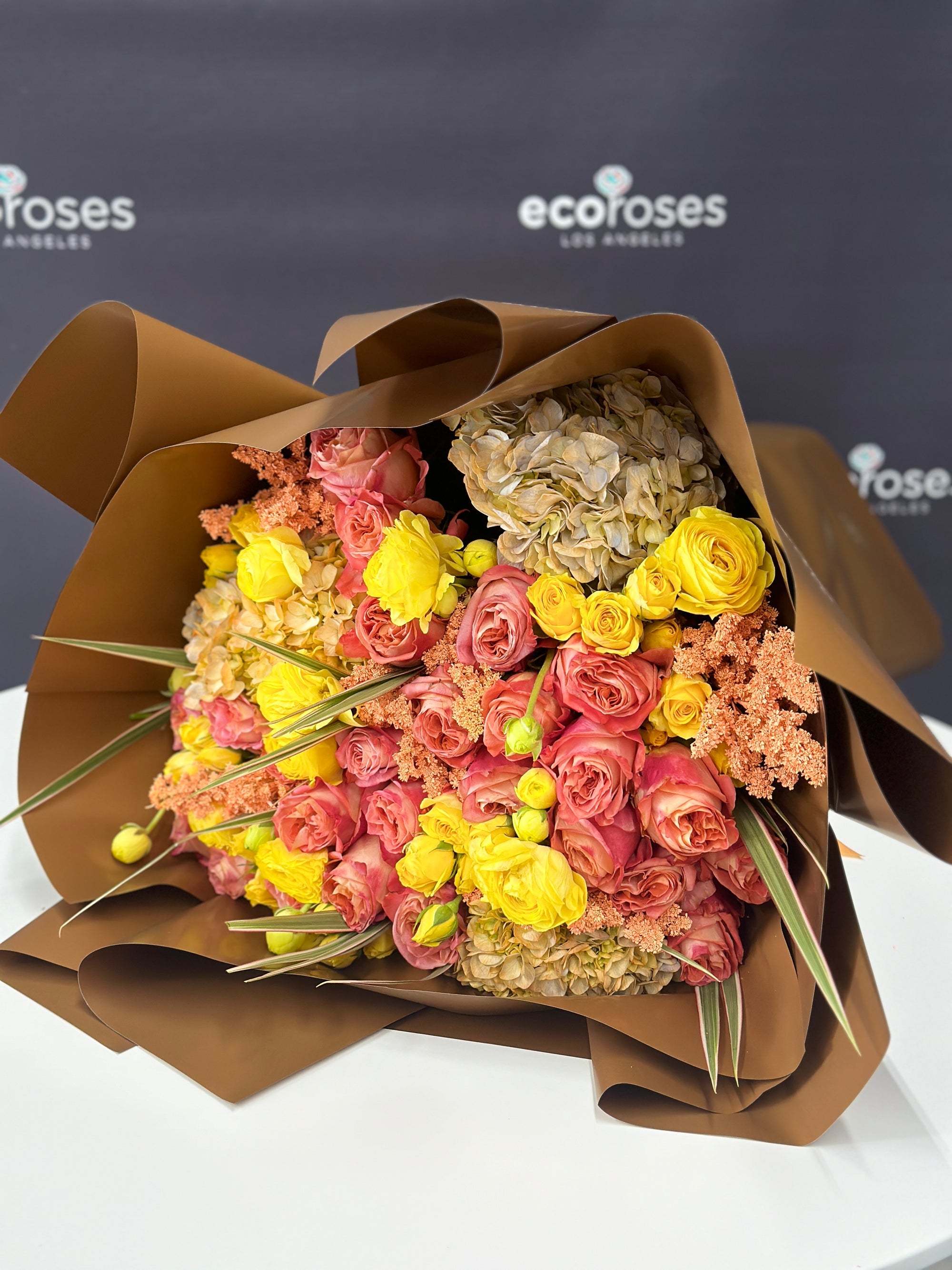 Glendale Flowers Amber Glow Bouquet! This deluxe bouquet features vibrant yellow roses that will brighten up any room. Perfect for bringing joy and sunshine to your loved ones.