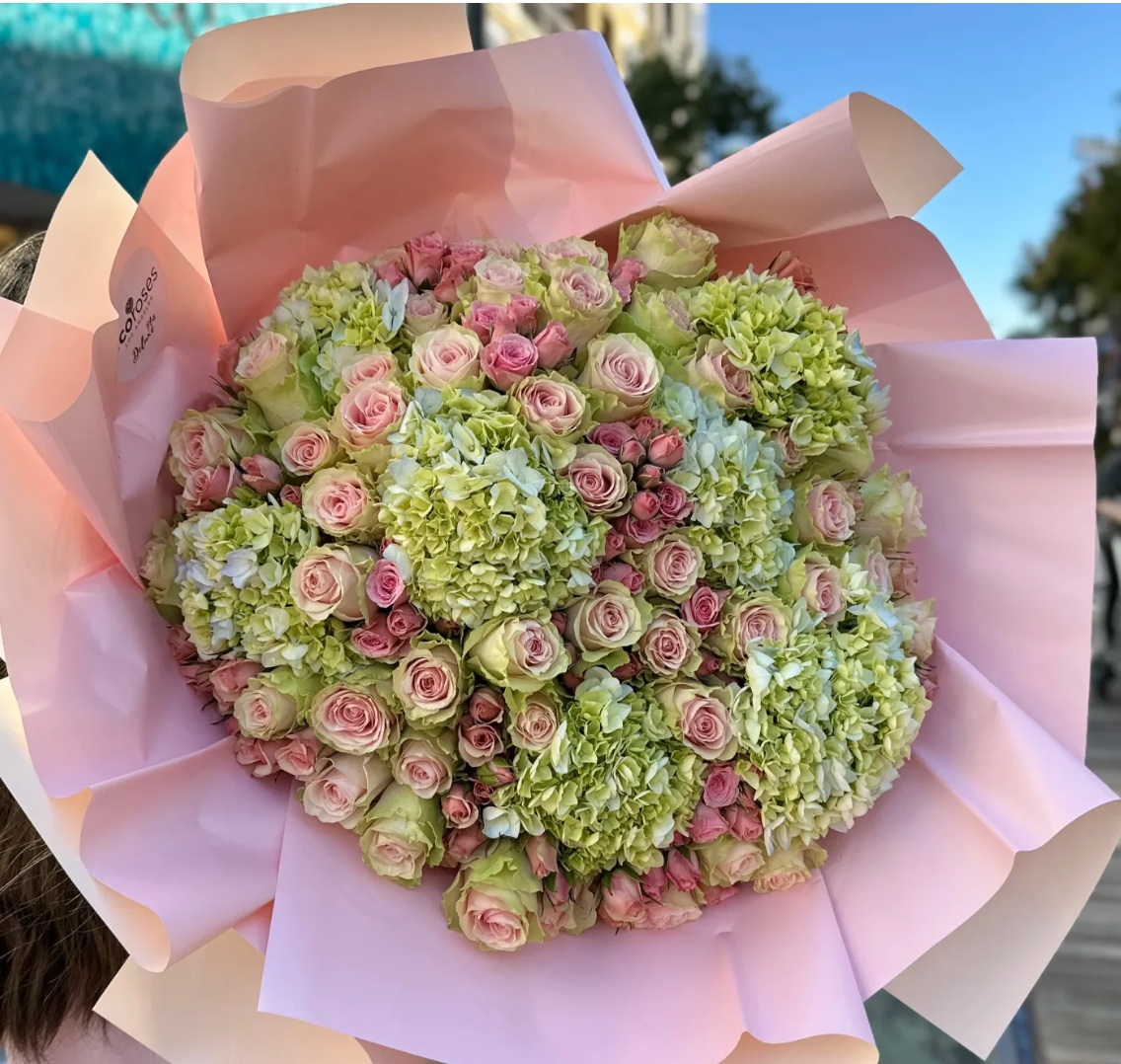 Hand tied Deluxe Plus Bouquet PinkDream with total of 50 stems of Fruttetto Roses including spray roses, Hydrangeas, fillers & paper wrapped -Flowers Glendale Ca
