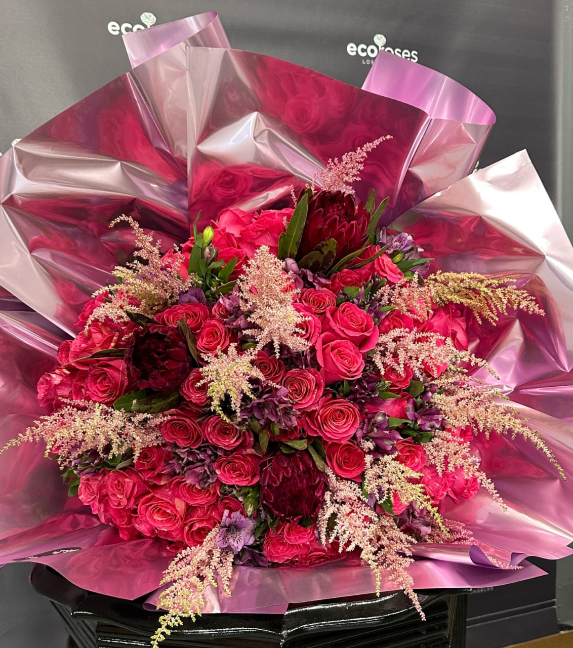 Deluxe Plus Bouquet with 75 Pandora Roses, King Proteas & Fillers - paper wrapped Flower Shops Glendale Ca